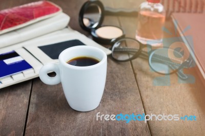 White Cup Hot Black Coffee On Wood Table With Working Women Thin… Stock Photo