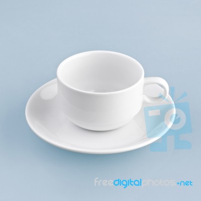 White Cup On Blue Background Solid Stock Photo