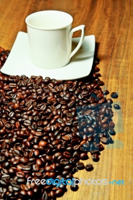 White Cup With Coffee Beans Stock Photo