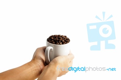 White Cup With Coffee Beans Isolated Stock Photo