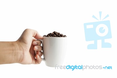 White Cup With Coffee Beans Isolated Stock Image