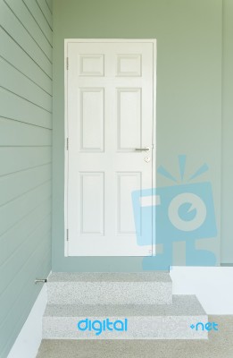 White Door On The Blue Wall Stock Photo