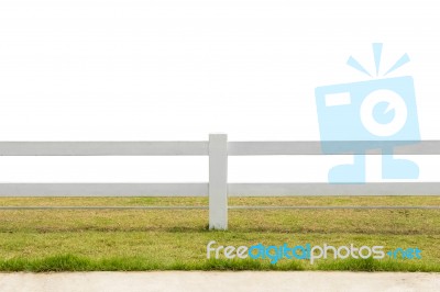 White Fence On Grassland Isolated Background Stock Photo