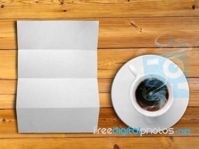 White Folded Paper And White Coffee Cup Stock Photo