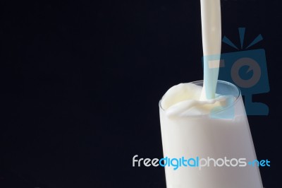 White Milk In Glass Stock Photo