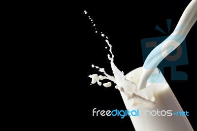 White Milk In Glass Stock Photo