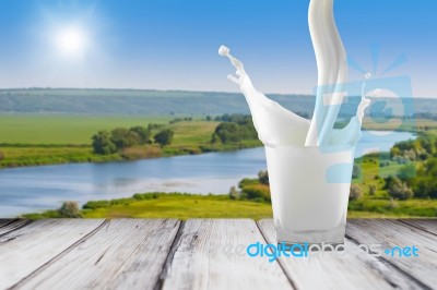 White Milk In Glass On The Table Stock Photo