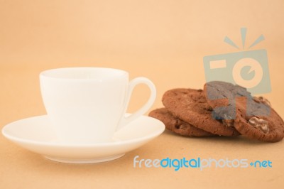 White Mug Of Hot Coffee And Chocolate Cookies Stock Photo