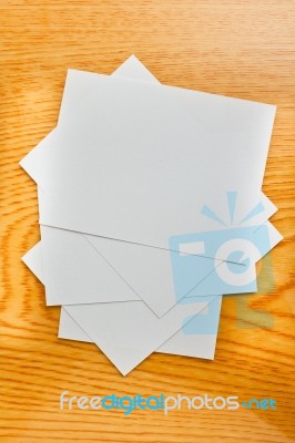 White Paper On Wood Table Stock Photo