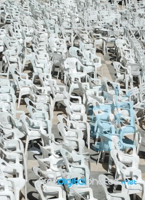 White Plastic Chairs Background Stock Photo