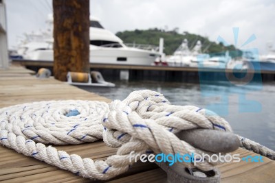 White Rope With Mooring Bollard Stock Photo