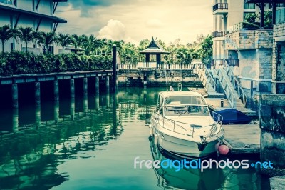 White Speed Boat At The Pier, Vintage Style Photograph Stock Photo