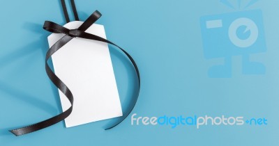 White Tag With Black Ribbon Stock Photo