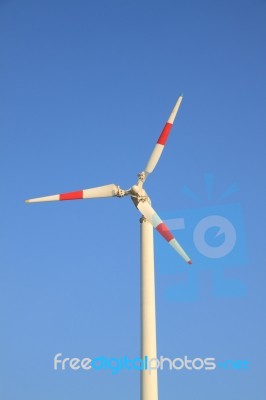 White Windmill With Red Bar Stock Photo