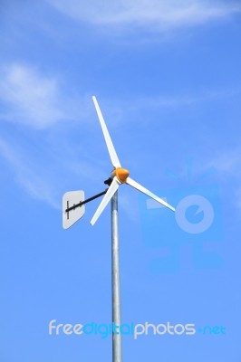 White Windmill With Rudder Stock Photo