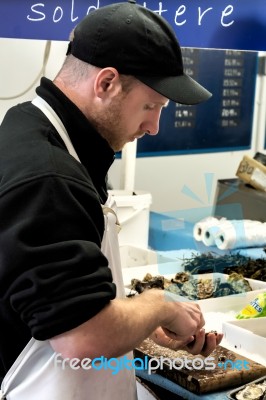 Whitstable, Kent/uk - September 1 : Man Opening Oysters In Whits… Stock Photo