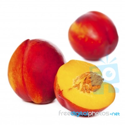 Whole and halved Nectarines Stock Photo