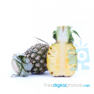 whole and halved Pineapple Stock Photo