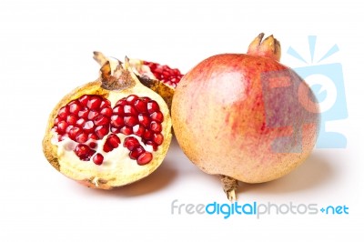 Whole And Halved Pomegranate Stock Photo