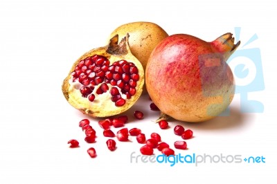 Whole And Halved Pomegranate Stock Photo