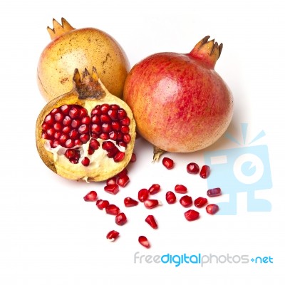 Whole And Halved Pomegranate Stock Photo