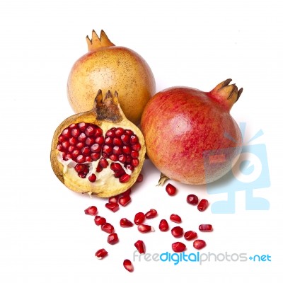 Whole And Halved Pomegranate Stock Photo