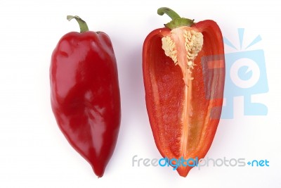 whole and halved Red Peppers Stock Photo