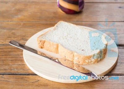 Whole Grain Bread On Wooden Plate Stock Photo