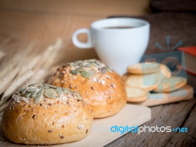 Whole Wheat Bread And Cracker With Cup Of Coffee On Wood Backgro… Stock Photo