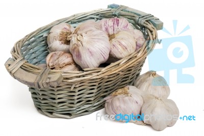 Wicker Basket Full Of Garlic Heads Stock Photo