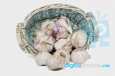 Wicker Basket Full Of Garlic Heads Stock Photo