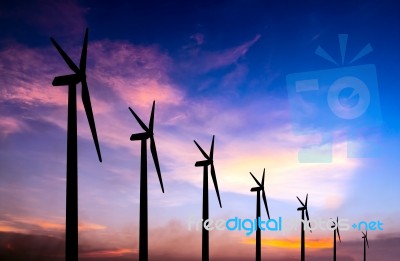 Wind Turbine Silhouette On Colorful Sunset Stock Photo