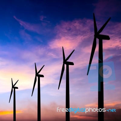 Wind Turbine Silhouette On Colorful Sunset Stock Photo