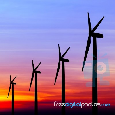 Wind Turbine Silhouette On Colorful Sunset Stock Photo