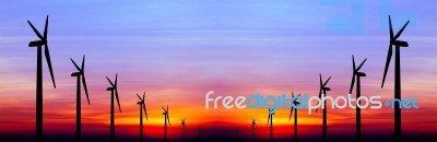 Wind Turbine Silhouette On Colorful Sunset Stock Photo