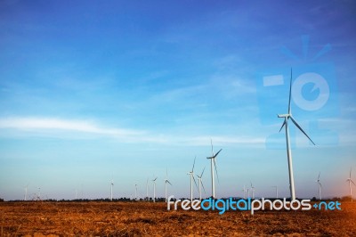 Wind Turbines On Farm Land Stock Photo