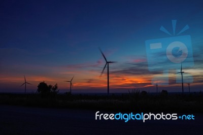 Wind Turbines With Silhouettes Stock Photo