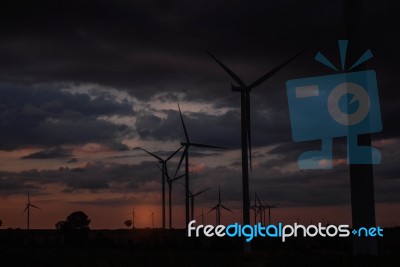 Wind Turbines With The Sunset Stock Photo