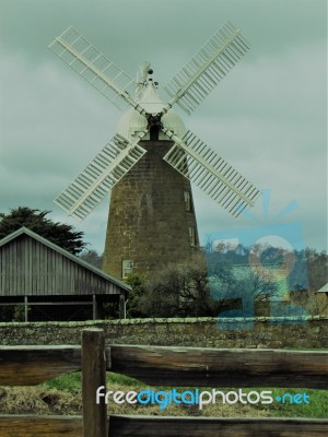 Windmill And Buildings Stock Photo