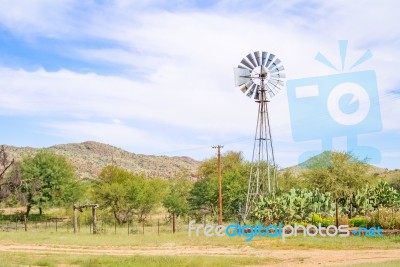 Windmill On The Farm In Namibia Stock Photo