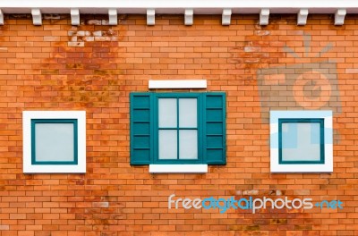 Window On The Orange Brick Wall Stock Photo