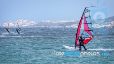 Windsurfing At Porto Pollo In Sardinia Stock Photo