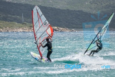 Windsurfing At Porto Pollo In Sardinia Stock Photo