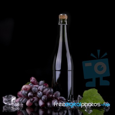 Wine Bottle With Red Grape Stock Photo