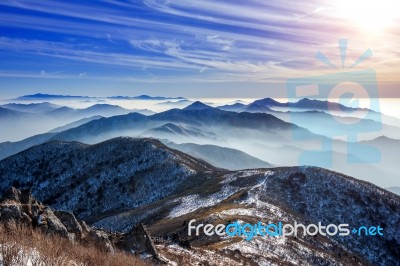 Winter Landscape With Sunset And Foggy In Deogyusan Mountains, South Korea Stock Photo