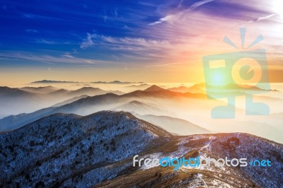 Winter Landscape With Sunset And Foggy In Deogyusan Mountains, South Korea Stock Photo