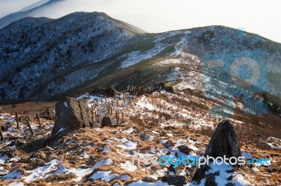 Winter Landscape With Sunset And Foggy In Deogyusan Mountains, South Korea Stock Photo