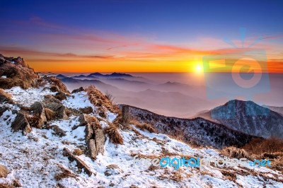 Winter Landscape With Sunset And Foggy In Deogyusan Mountains, South Korea Stock Photo