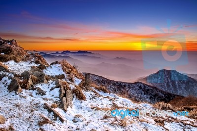 Winter Landscape With Sunset And Foggy In Deogyusan Mountains, South Korea Stock Photo