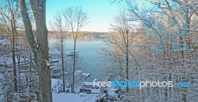 Winter Snowfall On The Lake Stock Photo